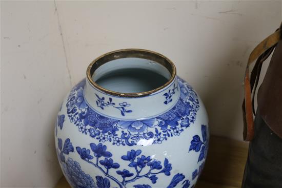 A Chinese blue and white painted lidded baluster vase, painted with blossoming peonies height 45cm, cracked